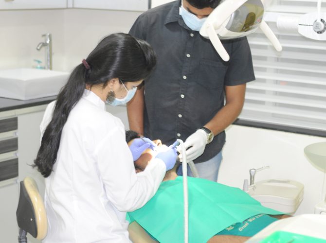 Dentist operating Patients - Dental Hub